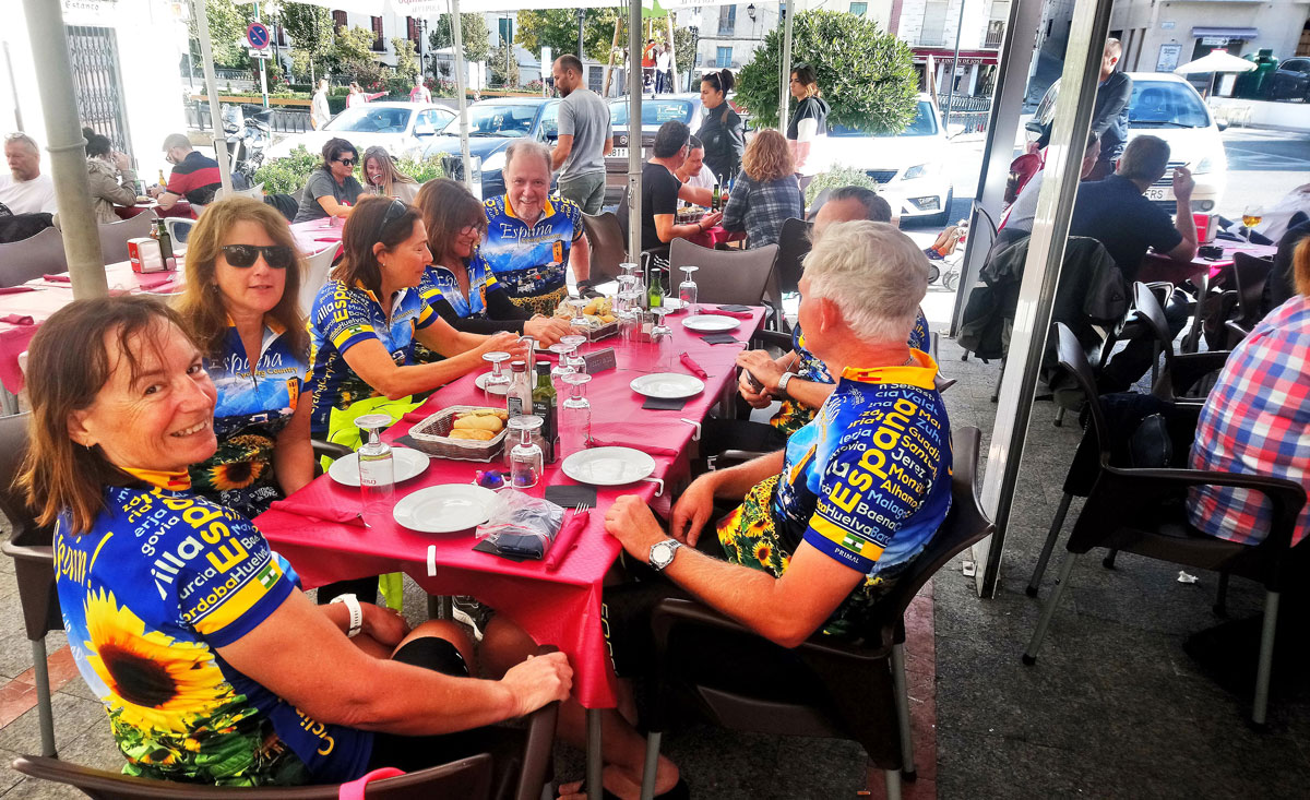 Cyclists having Paella in Spain